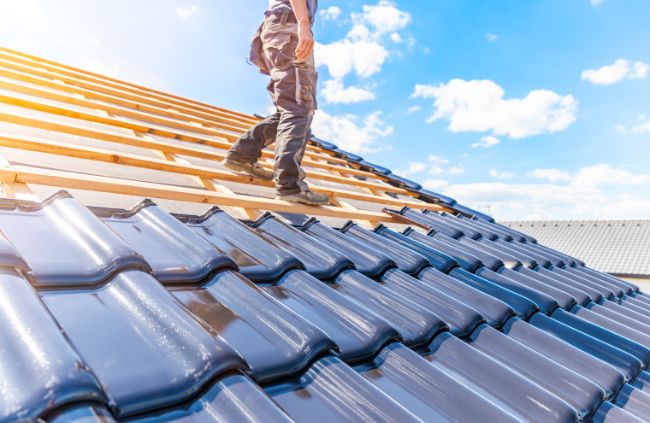 Roofing Guys Sydney installing new terracotta roof tiles as part of a full roof repair and restoration in Sydney. Built to last, matched to suit.