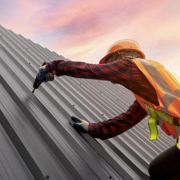 Roofer completing a metal roof in Hornsby with full replacement of old roofing sheets