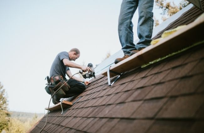 Roofing Guys Sydney team carrying out roof restoration work on a shingle roof to repair and protect the home