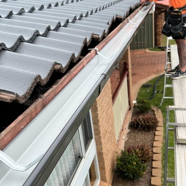 Professional gutter installation by Roofing Guys Sydney on a residential property.